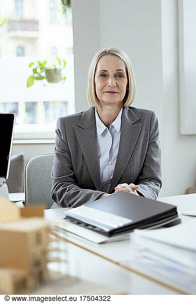 Senior businesswoman sitting at desk