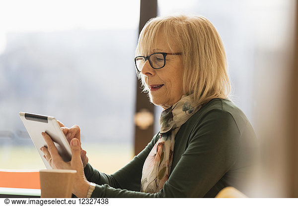 Senior businesswoman using digital tablet