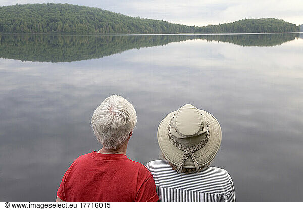 Senior Couple Looking Out Over A Lake  Algonquin Park  Ontario