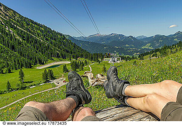 Senior couple relaxing on bench  Mountain Nebelhorn  Allgau  Bavaria  Germany