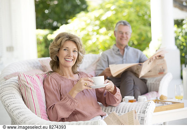 Senior couple relaxing on patio