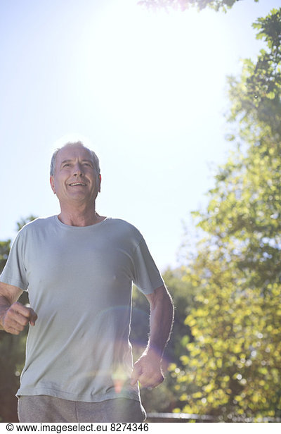 Senior man running outdoors