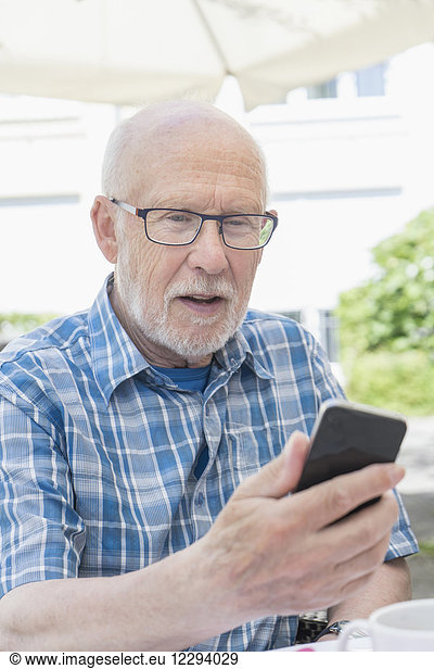 Senior man using smart phone