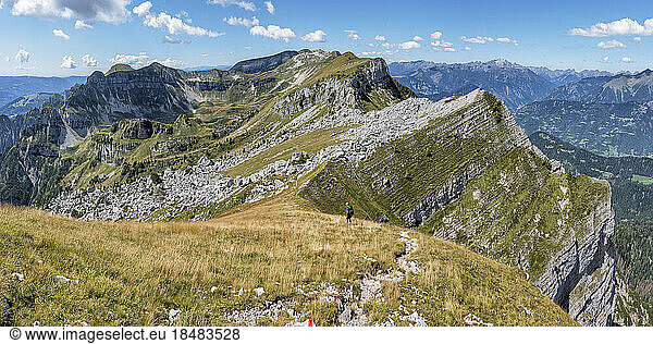 Senior woman hiking towards Passo Cereda at Dolomites  Italy