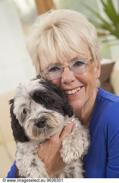 Senior woman loving her dog