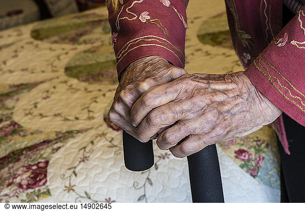 Senior woman's hands holding on to a cane; Olympia  Washington  United States of America