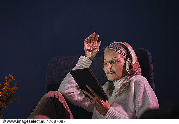 Senior woman using wireless technologies at home