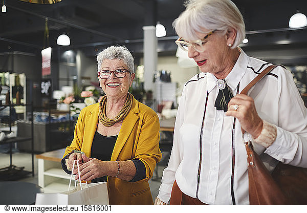 Senior women friends shopping