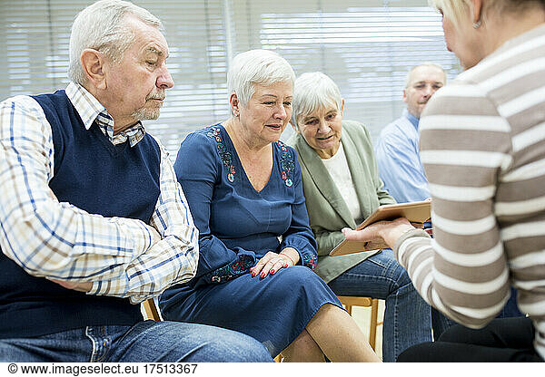Seniors in retirement home attending group event