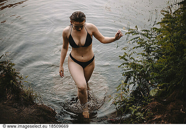 Sensual woman coming out from lake