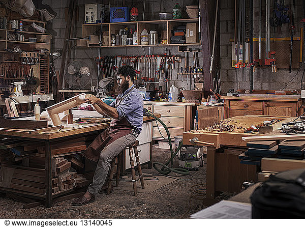Serious Carpenter working at workshop