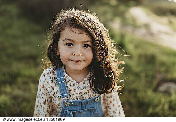 Serious portrait of young brunette girl with brown eyes