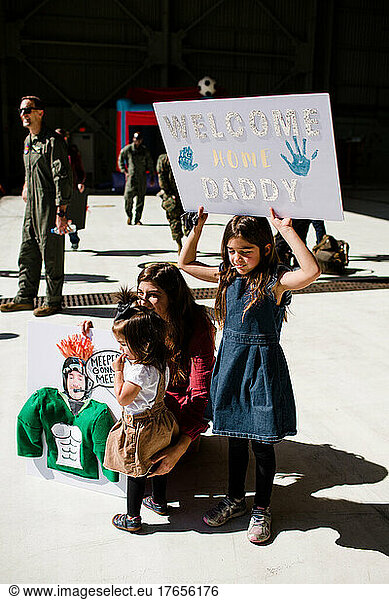 Seven Year Old Holding Sign for Military Dad's Return in San Diego