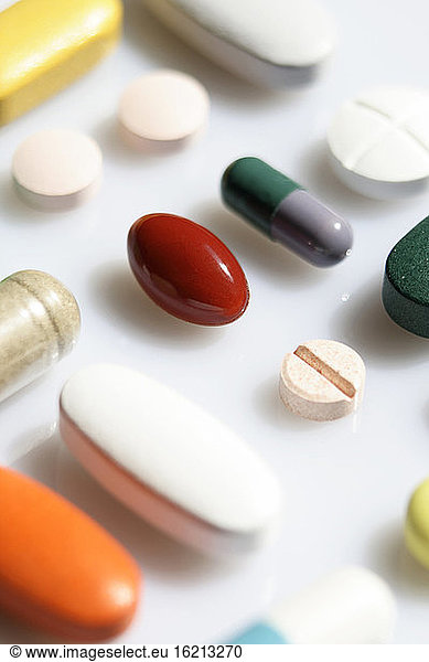 Several tablets and capsules  close-up