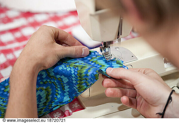 Sewing a costume for the a parade in Santa Barbara. The parade features extravagant floats and costumes.
