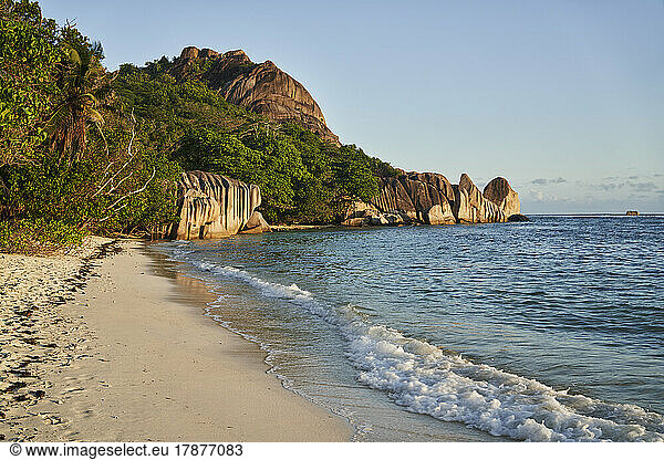 Seychelles  La Digue  Tropical beach in summer with rock formations in background