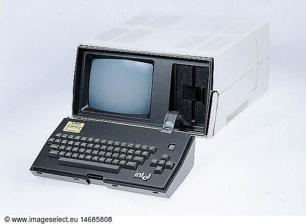 SG hist.  EDV / Elektronik  Computer  tragbarer Computer  Intel  einer der ersten Laptops  BÃ¼rocomputer  mit eingebautem Bildschirm  Diskettenlaufwerk  USA  um 1983 SG hist., EDV / Elektronik, Computer, tragbarer Computer, Intel, einer der ersten Laptops, BÃ¼rocomputer, mit eingebautem Bildschirm, Diskettenlaufwerk, USA, um 1983,