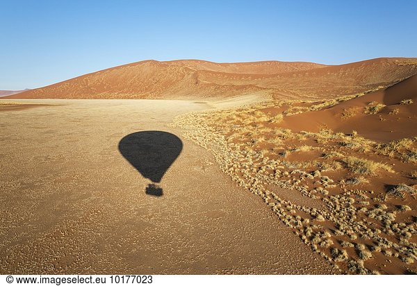Shadow of a hot-air balloon in the Namib Desert  photographed from the basket of the balloon  Namib-Naukluft National Park  Namibia  Africa