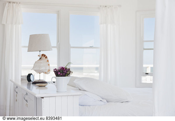 Shell lamp in bedroom overlooking ocean