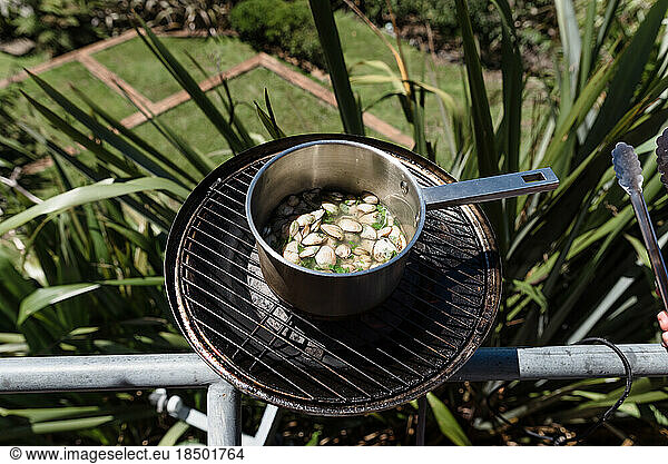 Shellfish cooking on a grill outside