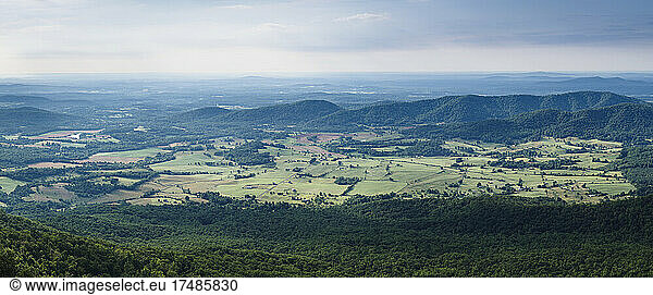Shenandoah Valley vista  elevated view over rolling countryside  fields and farms in Virginia.