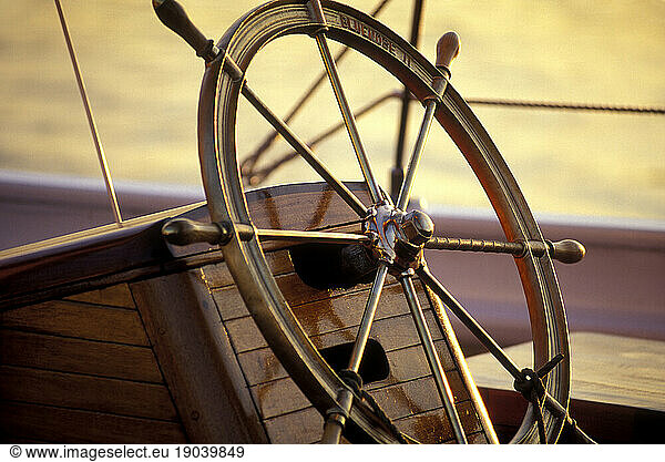 Ship wheel at sunset.