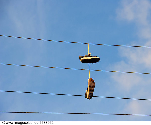 Shoes Hanging from Power Line
