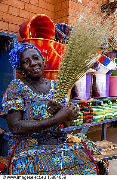 Shopkeeper making craft in Koudougou  Burkina Faso.