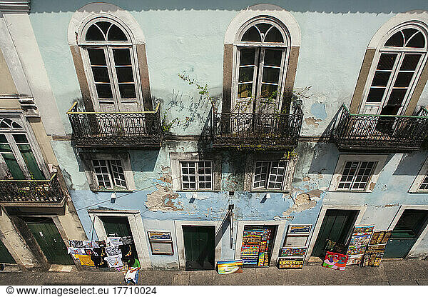 Shopkeepers And Craftsmen Display Paintings And T-Shirts In The Doorways Of Old Colonial Buildings In The Historical Centre Of Salvador; Salvador  Brazil