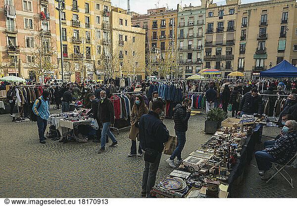 Shoppers at a Flea Market  Placa de Salvador Segui  El Raval  Barcelona  Spain; Barcelona  Spain