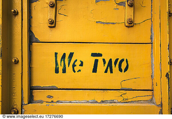 Short phrase on side of yellow weathered truck