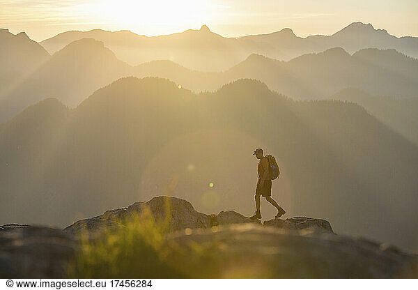 side view of hiker walking on rocky alpine ridge  Vancouver B.C.