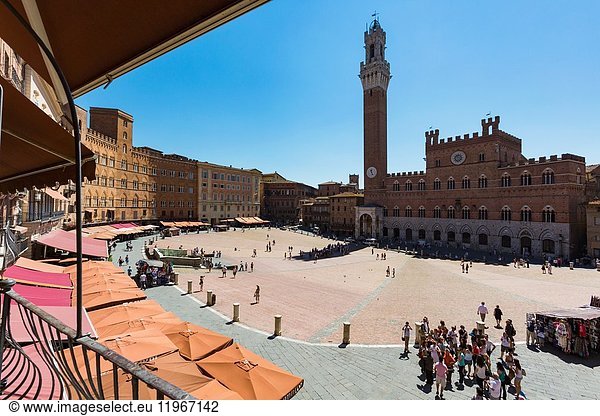 Siena  Siena Province  Tuscany  Italy. The Palazzo Pubblico with the Torre de Mangia seen across the Piazza del Campo. The Historic Centre of Siena is a UNESCO World Heritage Site.