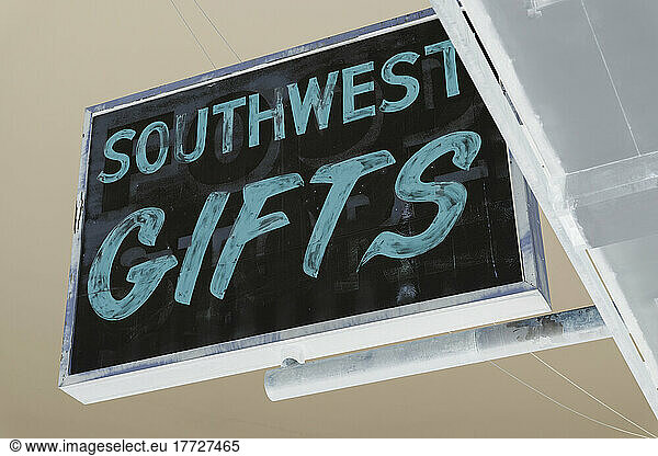 Sign advertising Southwest Gifts  inverted image.