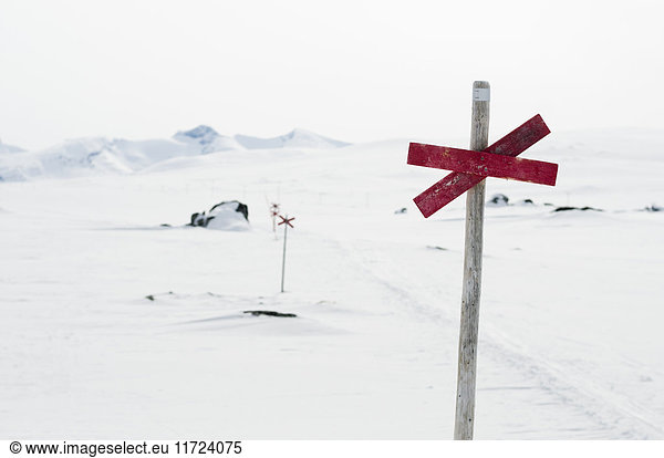 Sign on pole in winter