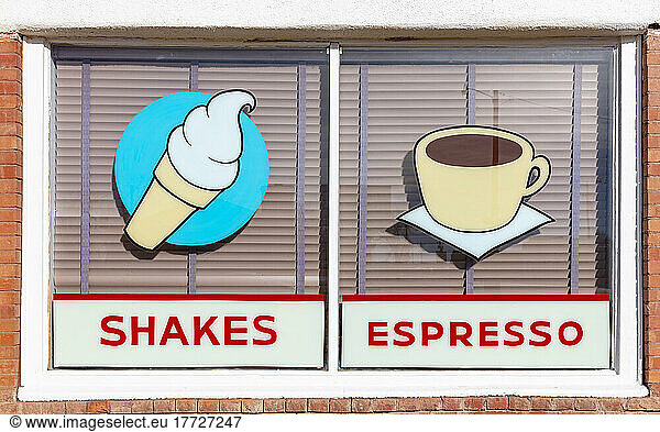 Signs for SHAKES and ESPRESSO  retro style signs on a cafe window.