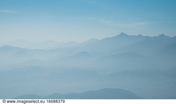 Silhouette blue mountain scenery background