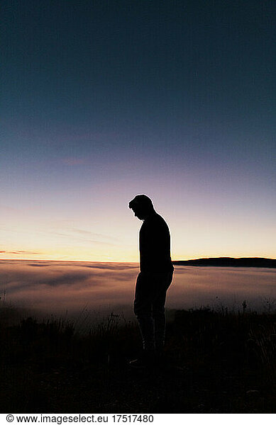 Silhouette of a boy from in a mountain