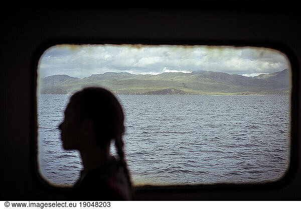 Silhouette of female passenger on Scottish ferry