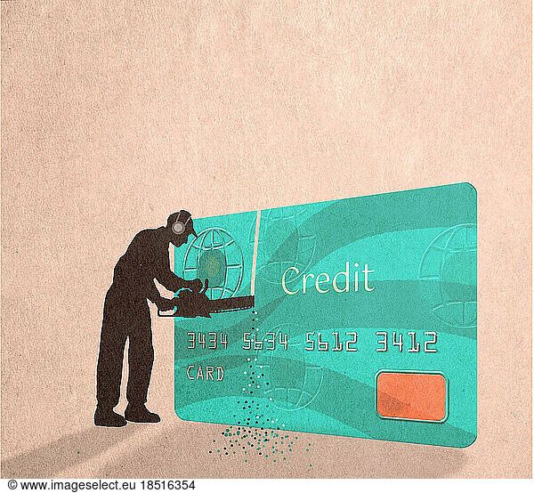 Silhouette of man cutting credit card with chainsaw