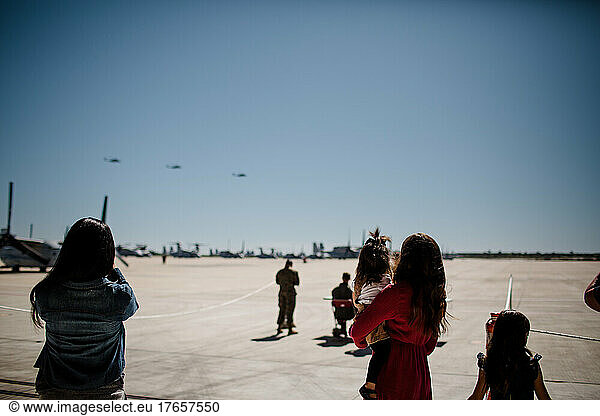 Silhouette of Mother & Daughters Waiting for Military Homecoming
