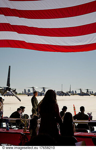 Silhouette of Mother & Two Daughters Waiting for Military Homecoming