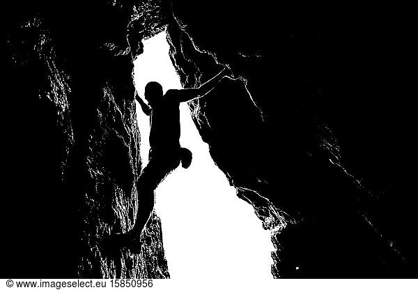 silhouette of rock climber in san francisco cave
