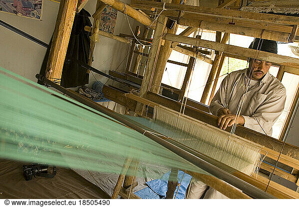 Silk cloth produced on these looms supply a silk scarf shop in Kabul.