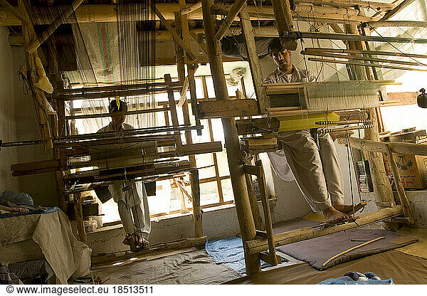 Silk cloth produced on these looms supply a silk scarf shop in Kabul.