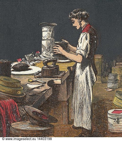 Silk hats. Hatter is putting black silk on hat frame. In centre background are two finished top hats covered in silver paper for protection. Chromolithograph from an English children"s book published 1867.