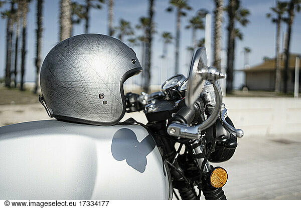 Silver helmet on motorcycle during sunny day