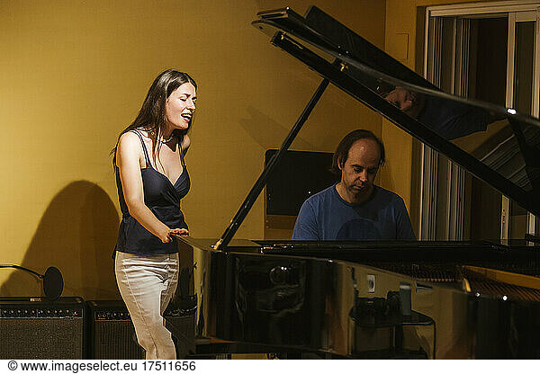 Singer and pianist in recording studio