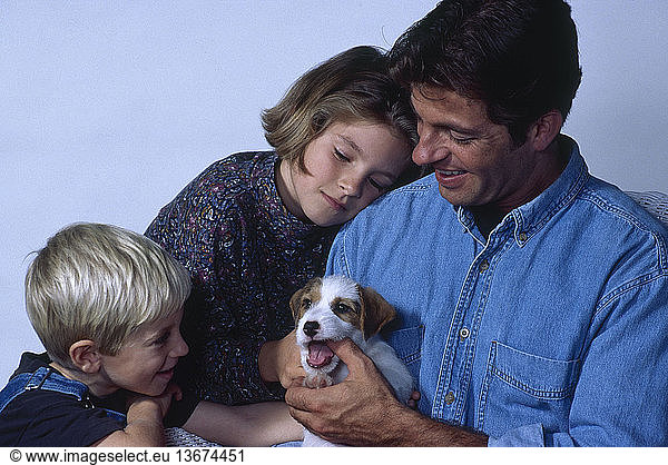 Single-parent family with their Jack Russell terrier puppy.