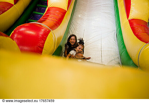 Sisters Playing in Bouncy House at Miramar in San Diego